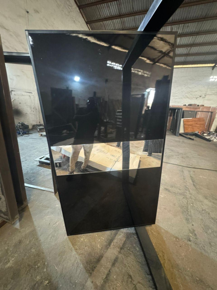 Polished black granite Pivot door