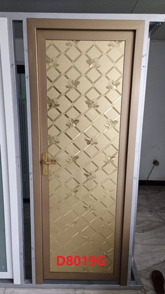 Aluminum and double glazed door with a golden finish