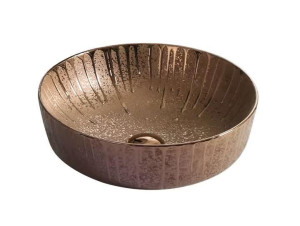 Round ceramic bathroom vessel sink with a textured, rose gold or copper-toned finish