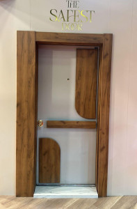 Modern wood-paneled Security or Interior door featuring a mix of wood grain and white finishs with unique curved accents and a security peephol