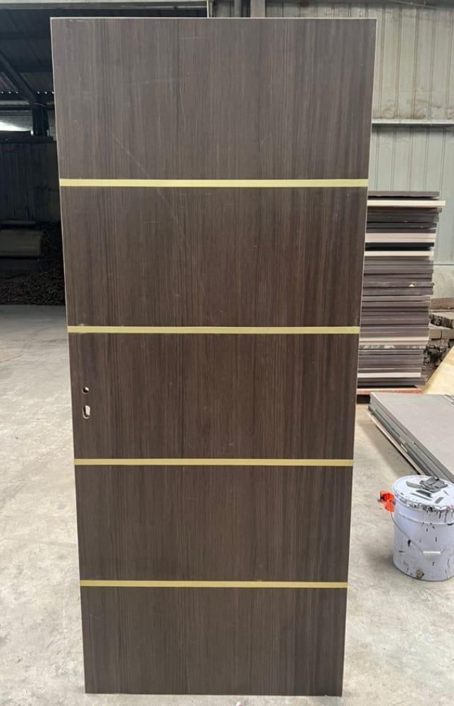 Turkish HDF wooden Interior door with dark wood grain finish and gold-coloured horizontal inlay strips