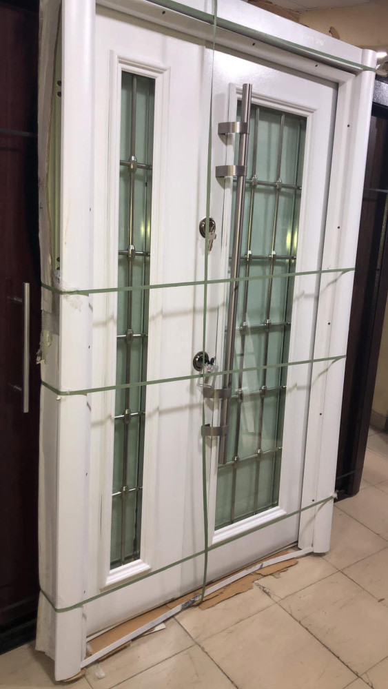 White Double entry door with a glass panels 